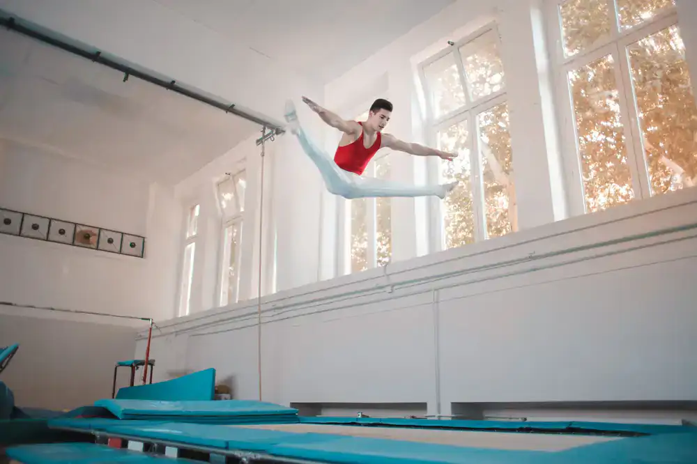 People jumping high at an indoor trampoline park